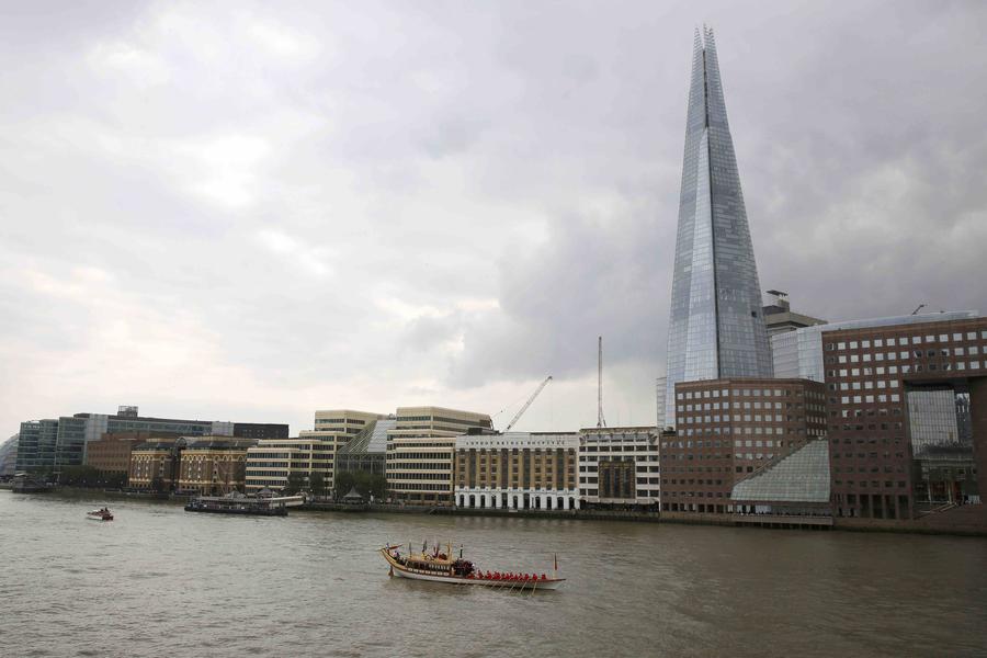 Flotilla sails down Thames to mark Queen's long reign