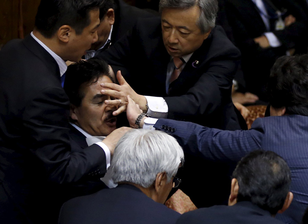 Japan upper house committee passes controversial security bills