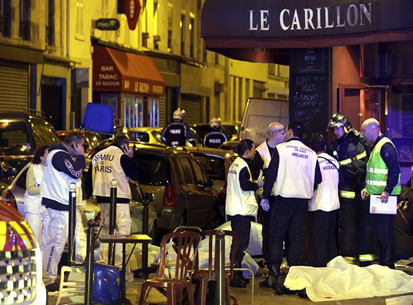 Over 100 dead in Paris shootings, hostages held: French media