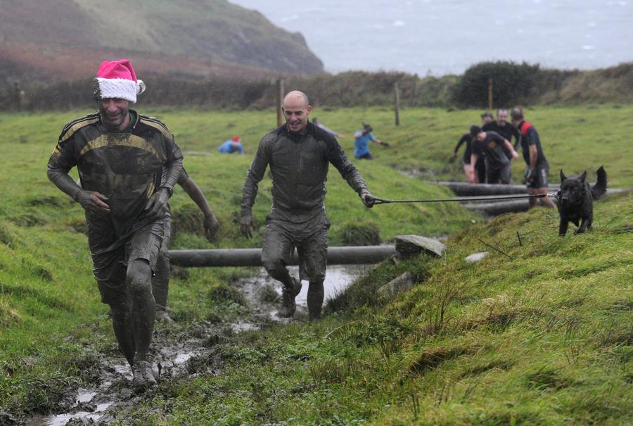 Brave competitors swamp in Christmas mud run