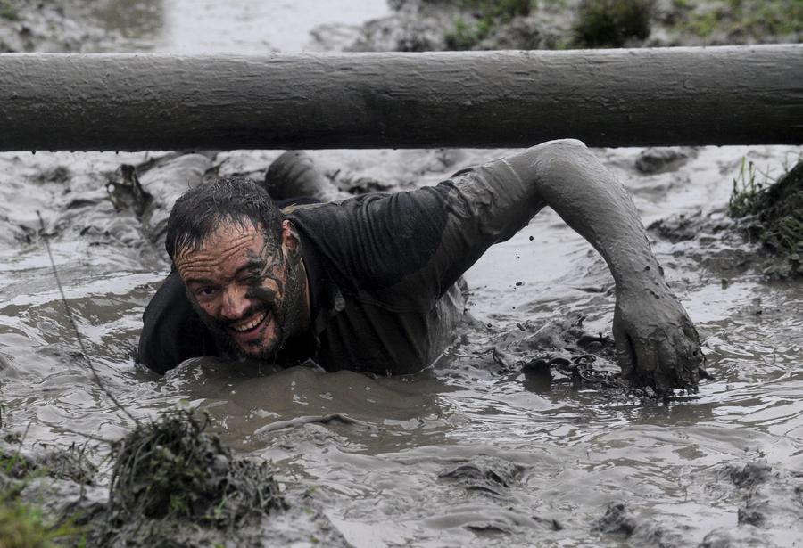 Brave competitors swamp in Christmas mud run