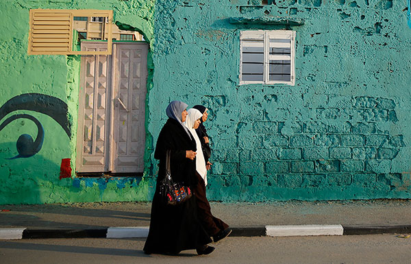 Painters bring new life to hard-hit areas in Gaza