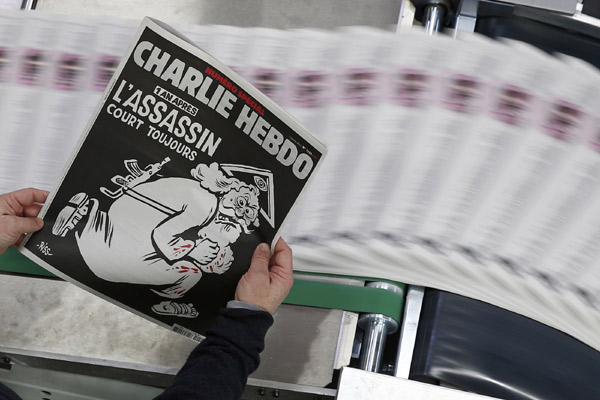 A year after attack, Charlie Hebdo cover cartoon stirs critics