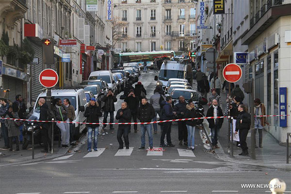 Man shot dead outside Paris police station, too early to call terror act