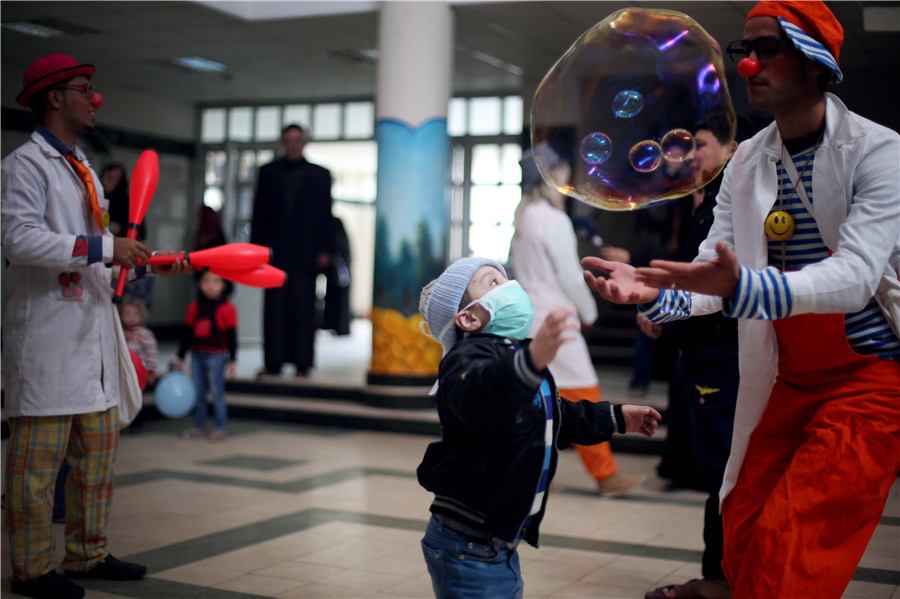 Clowns perform for children in Gaza hospital