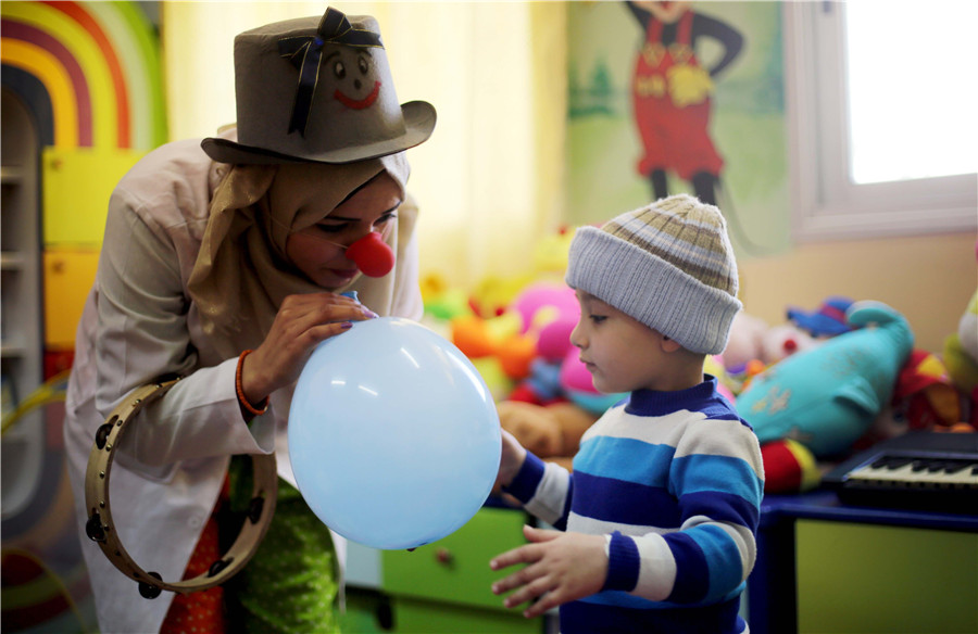 Clowns perform for children in Gaza hospital