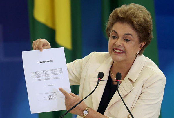 Brazil's Lula sworn in over protests as Rousseff faces impeachment