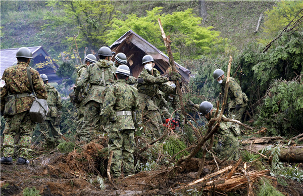 Japan quake rattles markets as factories shut; survivors queue for food