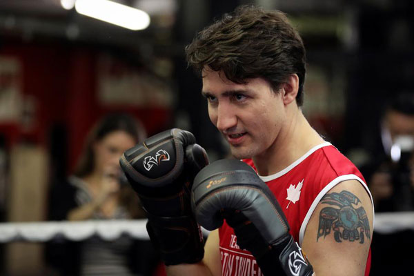 Canadian PM Trudeau slips from political ring to boxing ring