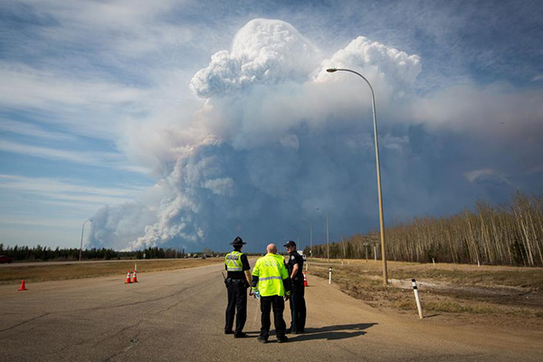 Epic wildfire threatens to engulf Canadian city as 88,000 flee