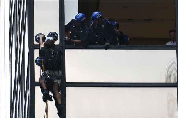 Man scaling Trump Tower in New York City pulled inside by police