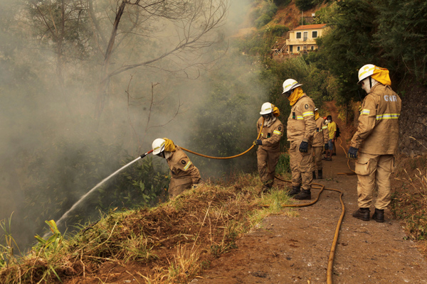 Portugal shows solidarity to firefighters as wildfires rage through country