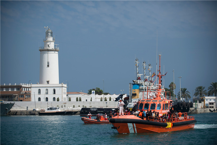 Back to safety: Spanish coast guard rescues African migrants