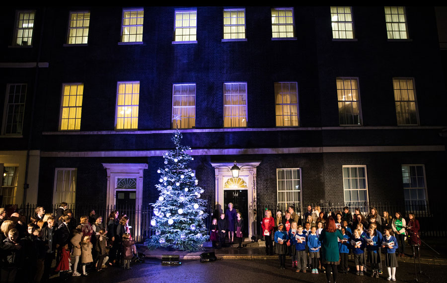 British PM lights Downing Street Christmas tree with local children