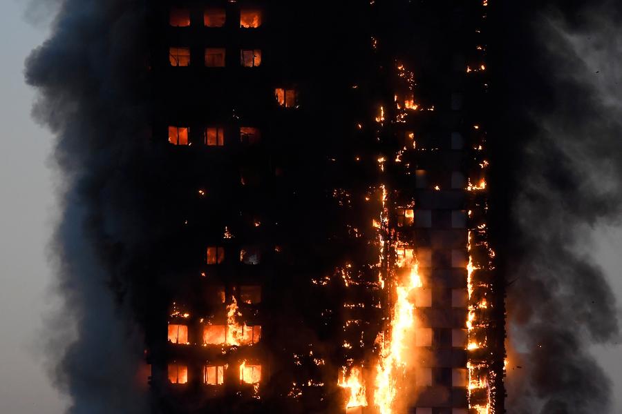 Fire engulfs London tower block, at least 12 dead