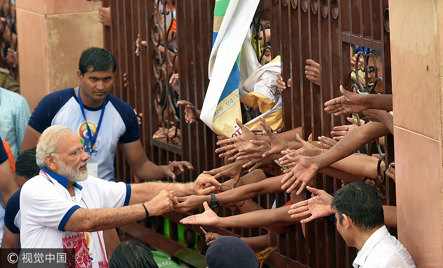 Thousands join India's Modi, hit the mat for International Yoga Day