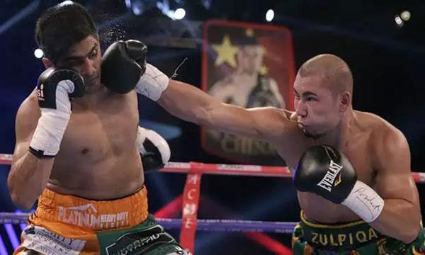 Indian boxer offers championship belt to Chinese rival as gesture of peace