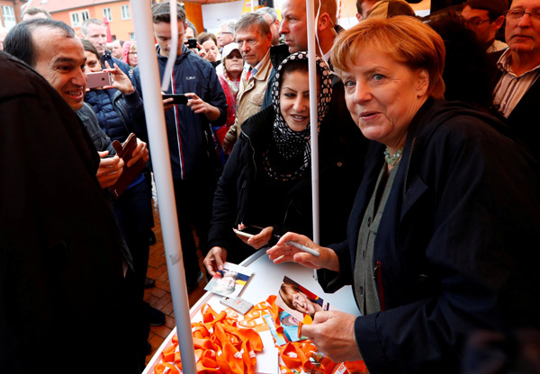 Merkel set to win the polls, boost ties with China