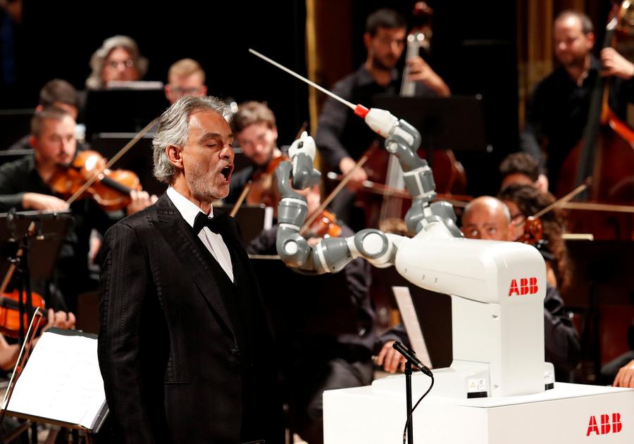 Robots conduct orchestra, play piano, read news