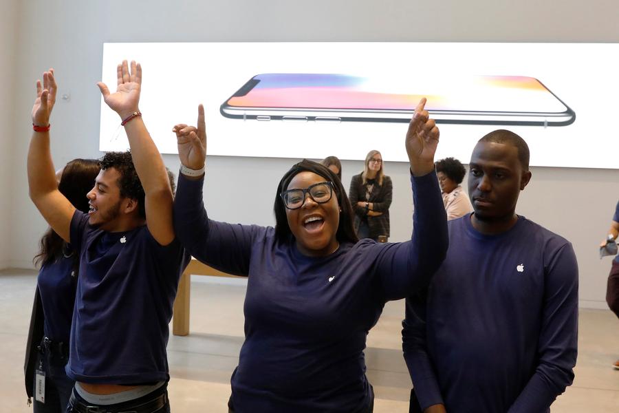 New iphones go on sale, with short lines at stores