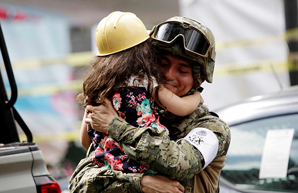 Mexicans turn to church as earthquake death toll hits 320