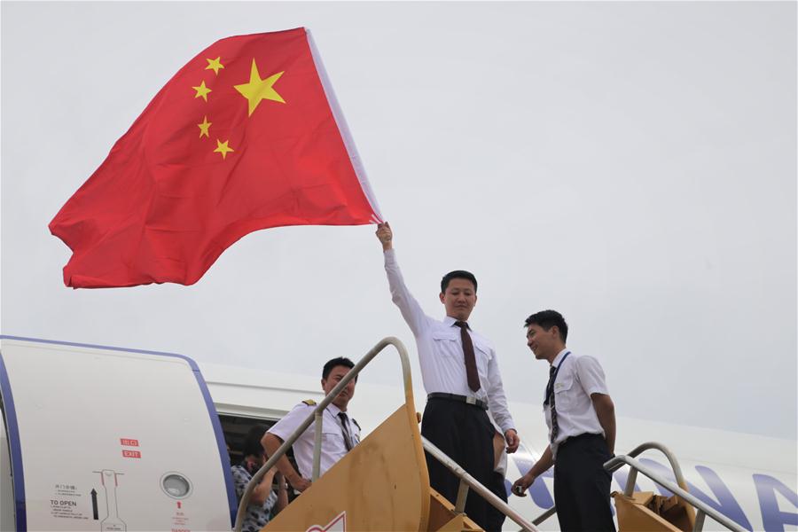 Chinese head home after hurricane