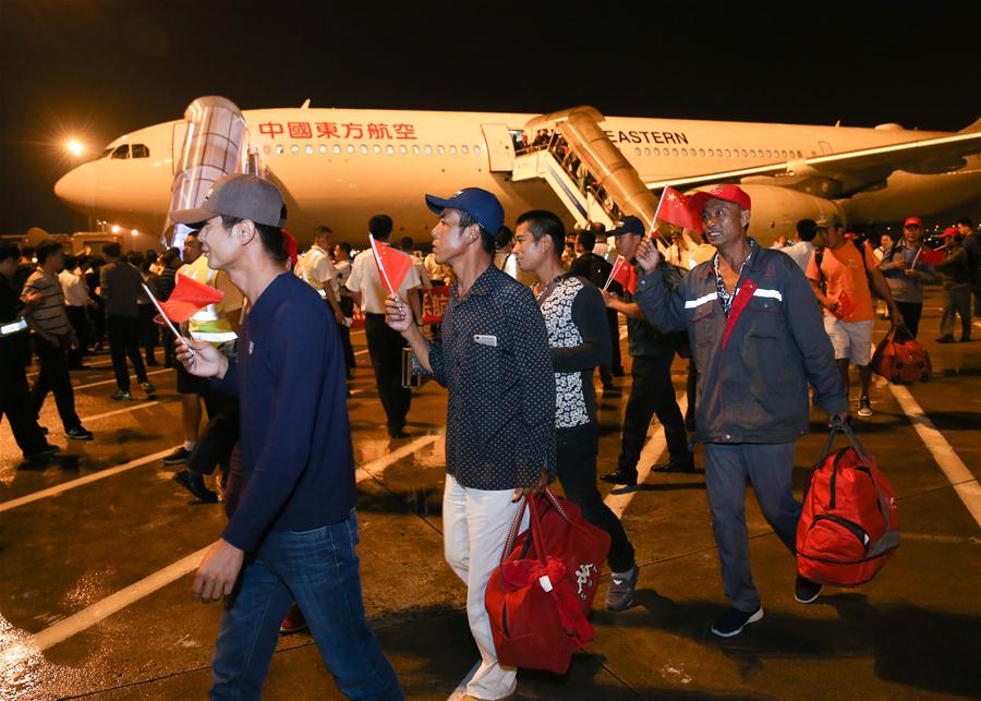 Chinese head home after hurricane