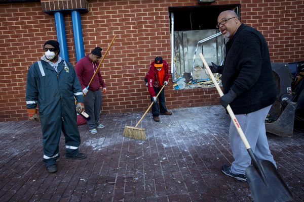 Baltimore erupts in riots after funeral of man who died in police custody