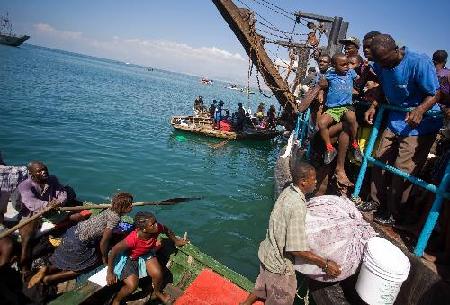 Haitians flee homeland by boat as in movie '2012'