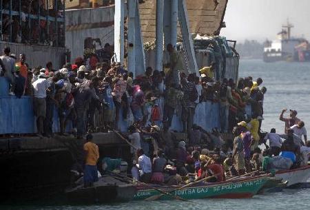 Haitians flee homeland by boat as in movie '2012'