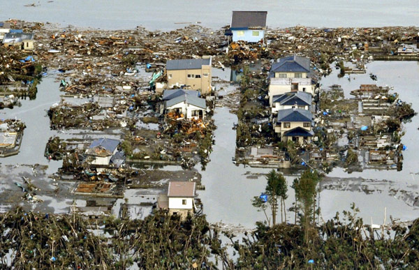 NE Japan coast ravaged by flood, fires after quake