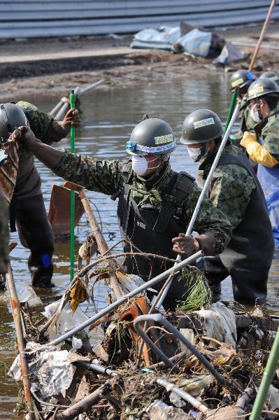 Death toll rises to 10,872 from Japan quake